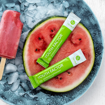 Neora Youth Factor® Superfood & Antioxidant (Powder) pictured with watermelon