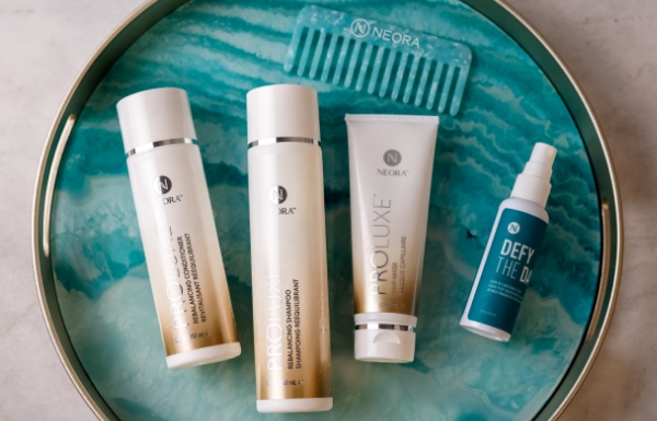 The Summer Hair Essentials Set is shown on a tray with a soothing water background 